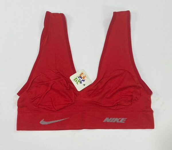 نیم‌تنه ورزشی نایک زنانه رنگ قرمز لاکی مدل کبریتی و جذب